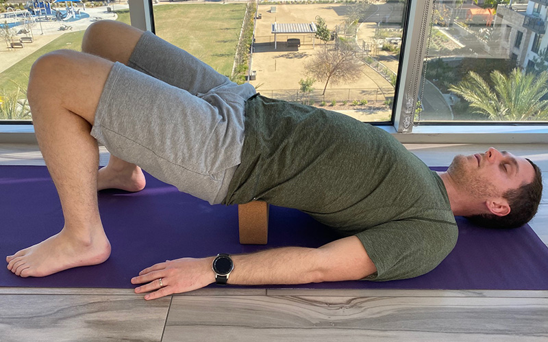 Supported bridge pose for stress relief