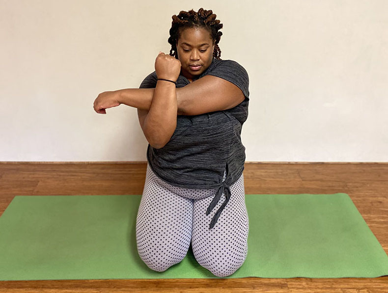 Arms over chest yoga pose
